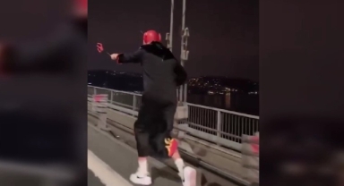Köprüde üzerine giydiği kostümle koşan zanlı yakalandı